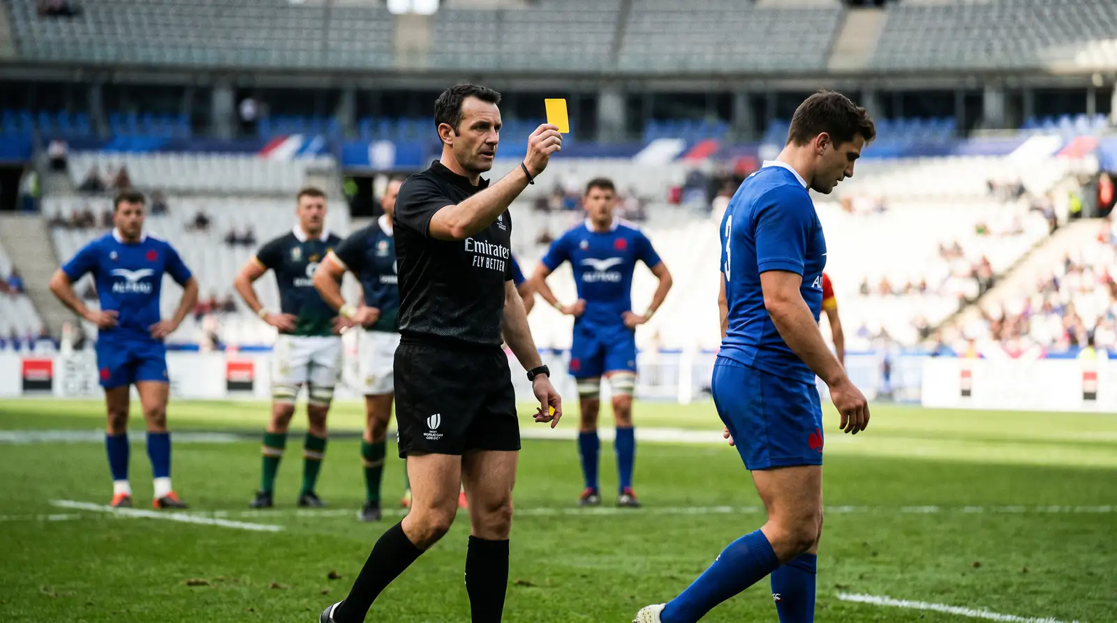 Rugby referee showing a yellow card to a player during a televised match